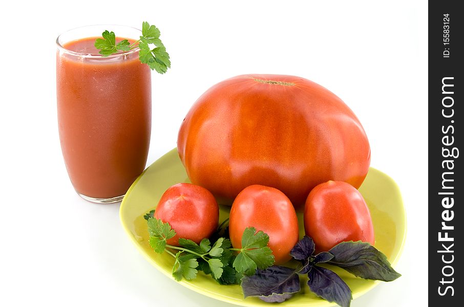 Big tomato with small tomatoes and juice