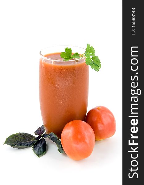 Small tomatoes and juice on white background