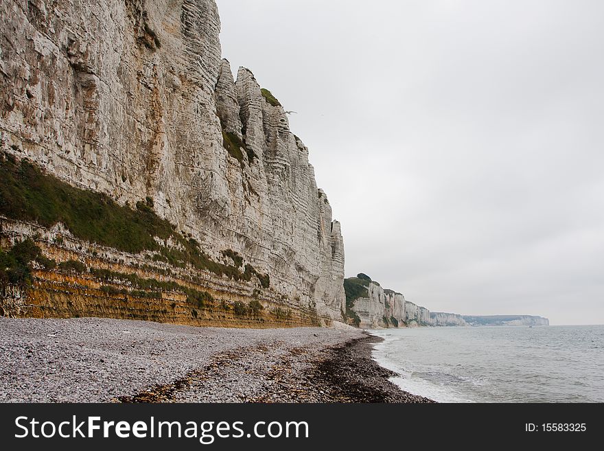 Cliffs on the north french coast. Beach on misty morning. Cliffs on the north french coast. Beach on misty morning