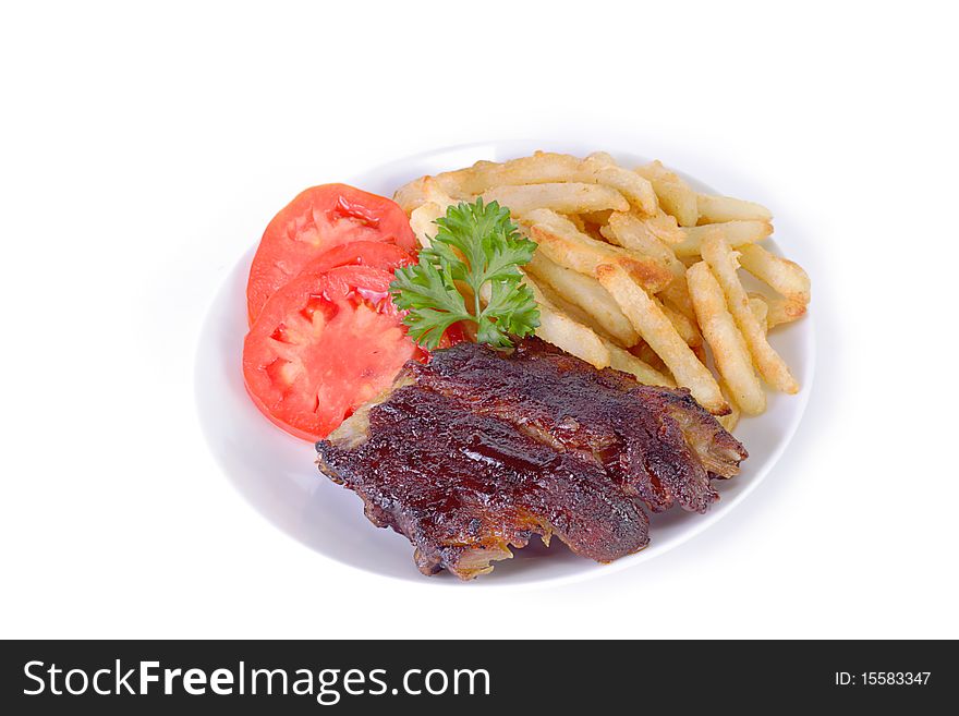 Tender juicy grilled baby back ribs and french fries on white background. Tender juicy grilled baby back ribs and french fries on white background