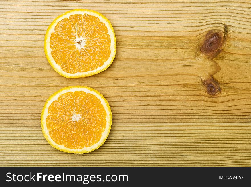Orange On Wood Background