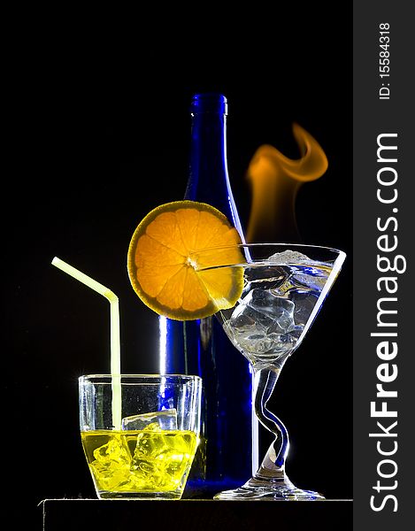 Cocktail with flame on the black background