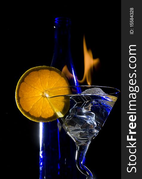 Cocktail with flame on the black background