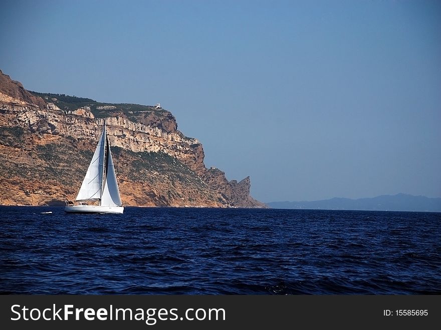 White Sail Yachts Over Rock In Cassis France