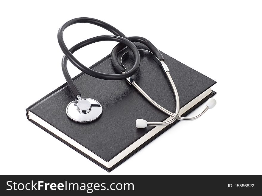 Black book and stethoscope on white