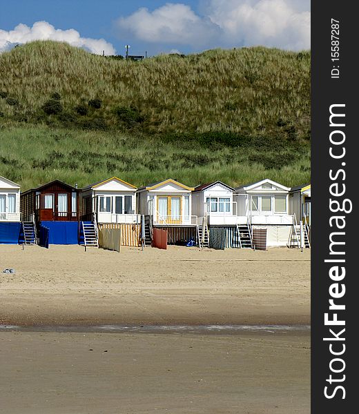 Wooden beach houses on the beach of Holland