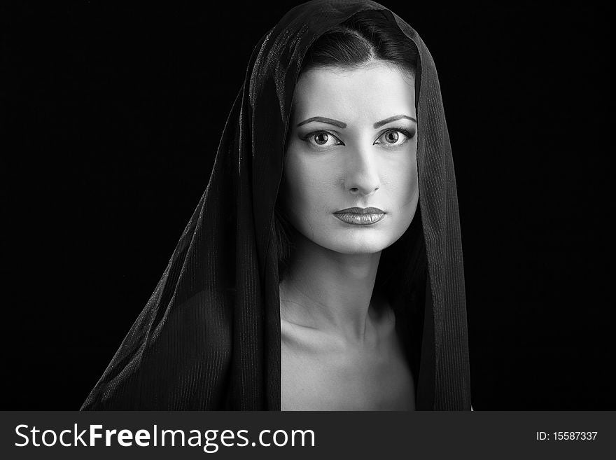 Portrait of elegant beautiful woman in shawl