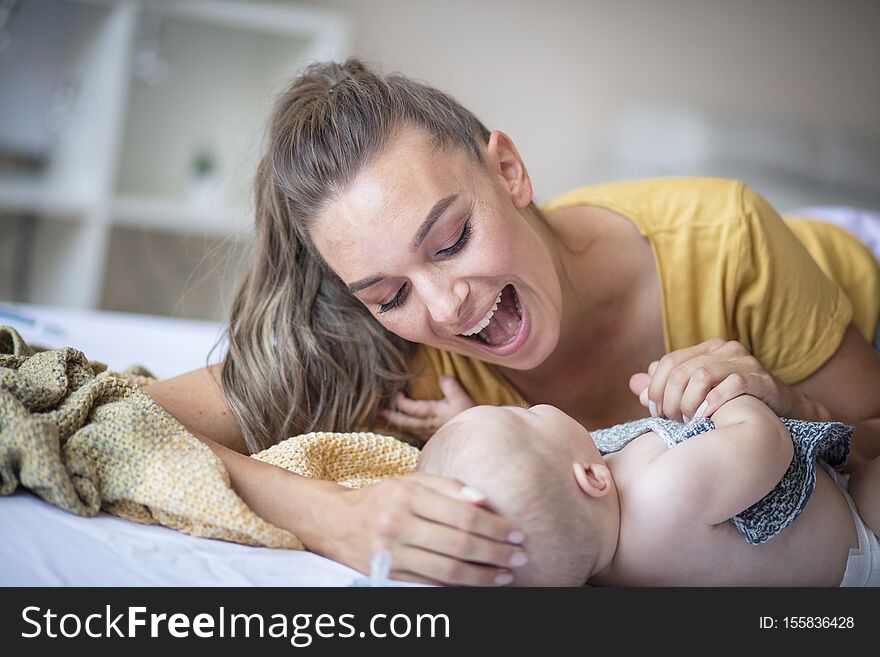 Did you know that you`re Mommy`s greatest treasure?  Mother and her baby boy at home