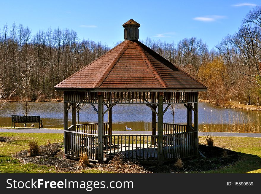 A gazebo found in Washington Lake Park, Turnersville, NJ in springtime and it frames a duck resting by the lake. A gazebo found in Washington Lake Park, Turnersville, NJ in springtime and it frames a duck resting by the lake.