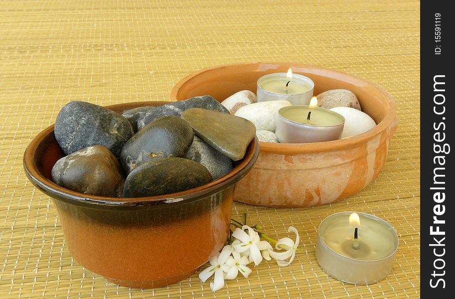 Spa. Massage stones, candles and jasmine