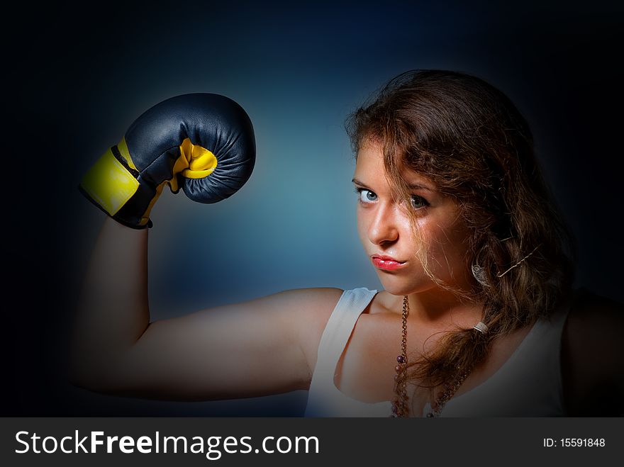 Young boxing woman showing power. Young boxing woman showing power