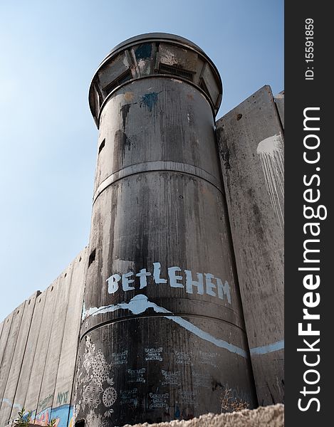 BETHLEHEM, OCCUPIED PALESTINIAN TERRITORIES - Activist graffiti adorns the Israeli separation wall and watch tower in the West Bank town of Bethlehem.