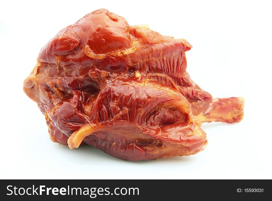 Boiled pork. Appetizing smoked meat close up on a white background