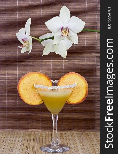 Cocktail in a glass and white orchid. Cocktail in a glass and white orchid