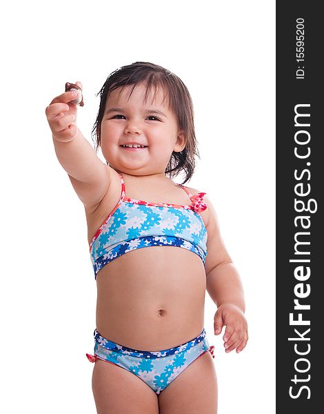 Little girl in swimming suit with a candy