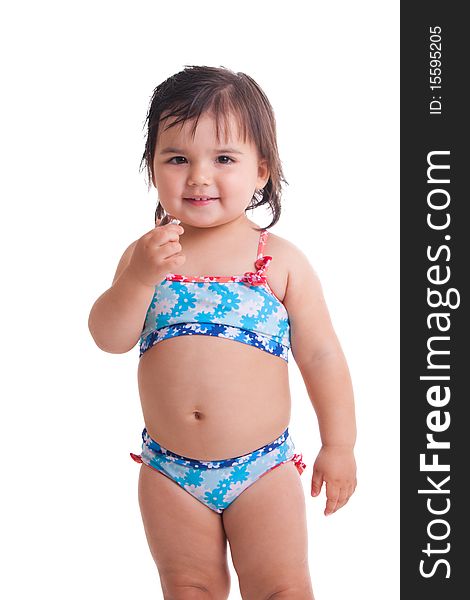Little girl in swimming suit with a candy