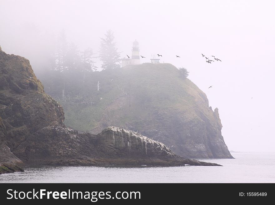 A cool foggy day in southwestern washington. this is the lighthouse at the inlet of the columbia river and pacific ocean. A cool foggy day in southwestern washington. this is the lighthouse at the inlet of the columbia river and pacific ocean