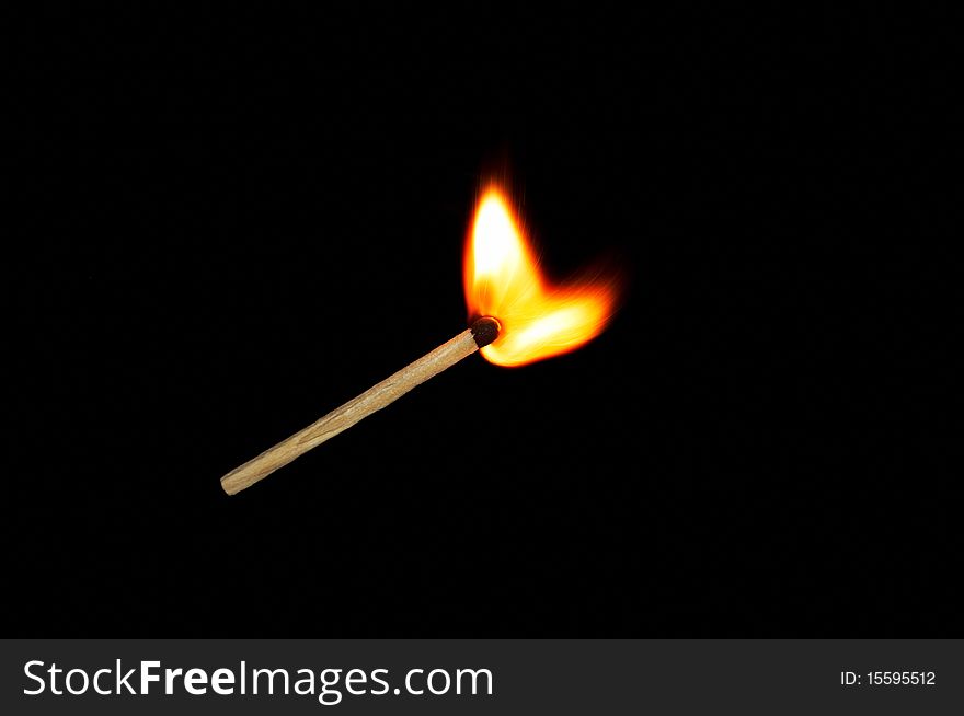 Light a match on a black background. Light a match on a black background