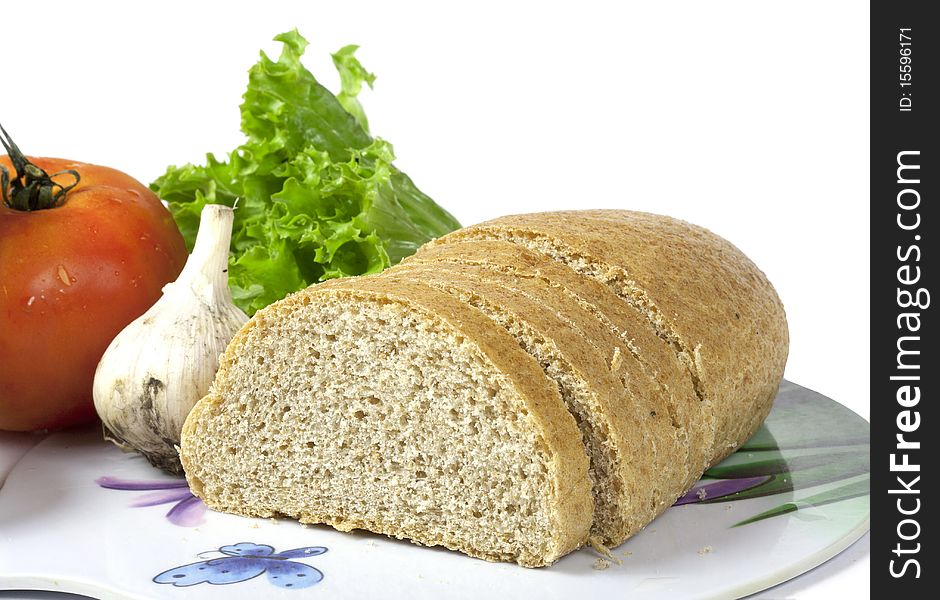 Bread and vegetables isolated on the white background