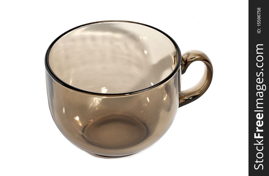 Transparent teacup made of glass isolated on the white background