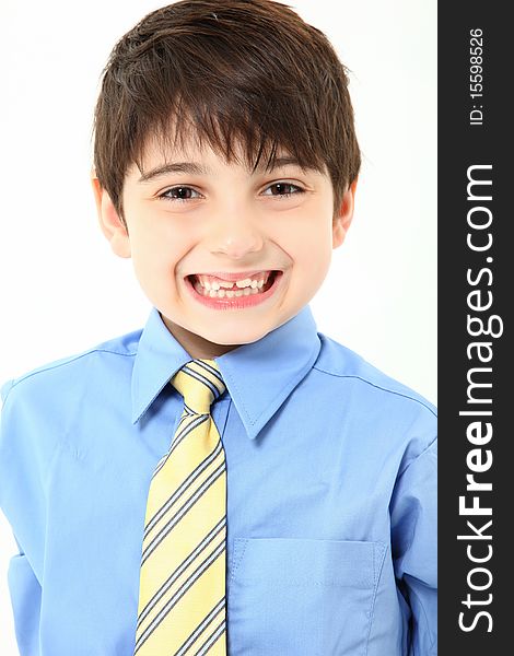 Adorable 7 year old french american boy close up in shirt and tie over white background. Adorable 7 year old french american boy close up in shirt and tie over white background.