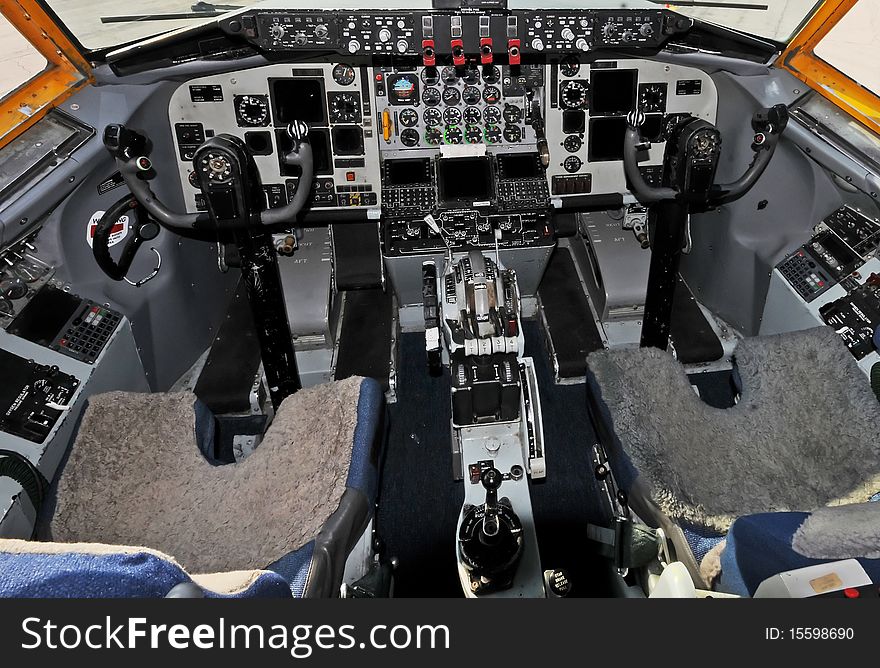 Classic jet airplane cockpit controls and seats