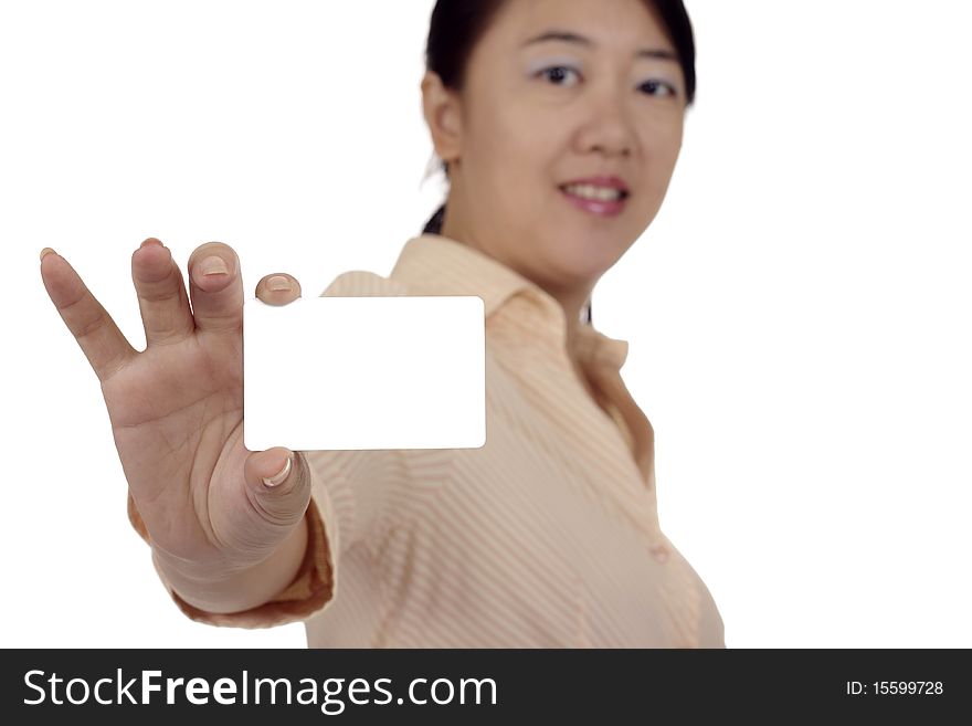 An Asian woman showing a blank business card. Clipping path included. An Asian woman showing a blank business card. Clipping path included.