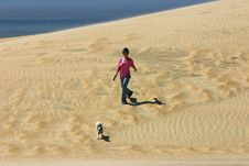 Girl Walks Dog On A Sand Dune Stock Photos Girl Walks Dog On A Sand Dune Stock Photos