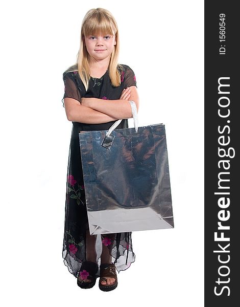 Young girl with shopping/gift bag and a content,satisfied,proud expression in black dress shot over white background. Young girl with shopping/gift bag and a content,satisfied,proud expression in black dress shot over white background.