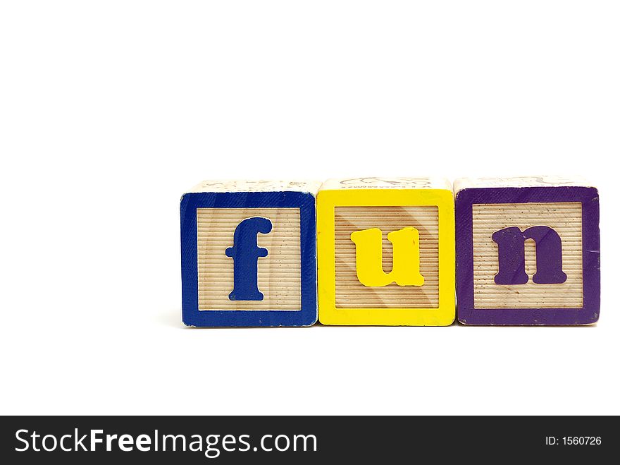 Arrangement of alphabet blocks spelling out the word fun in lower letters. Arrangement of alphabet blocks spelling out the word fun in lower letters