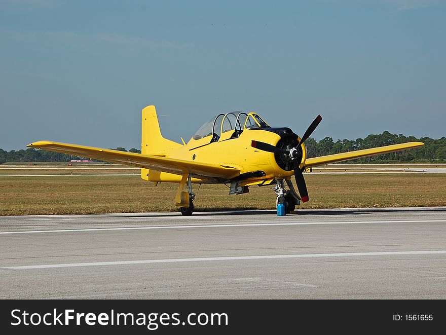 Vintage yellow airplane on the ground