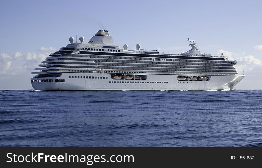 Mega cruise ship Crystal Serenity on a flat sea making passage to Cannes