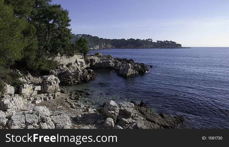 Rocky cove and beach on a calm autumn day. Rocky cove and beach on a calm autumn day