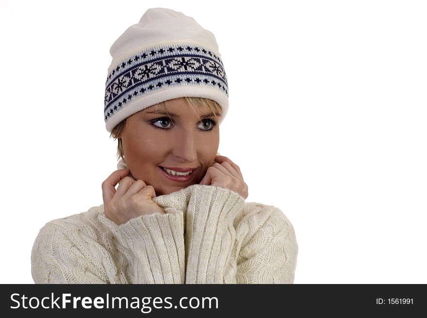 Young woman with cap in warm pullover on white. Young woman with cap in warm pullover on white