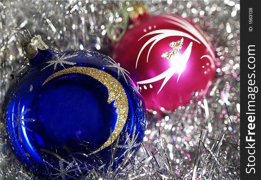 Blue and purple decoration balls on silver background. Blue and purple decoration balls on silver background