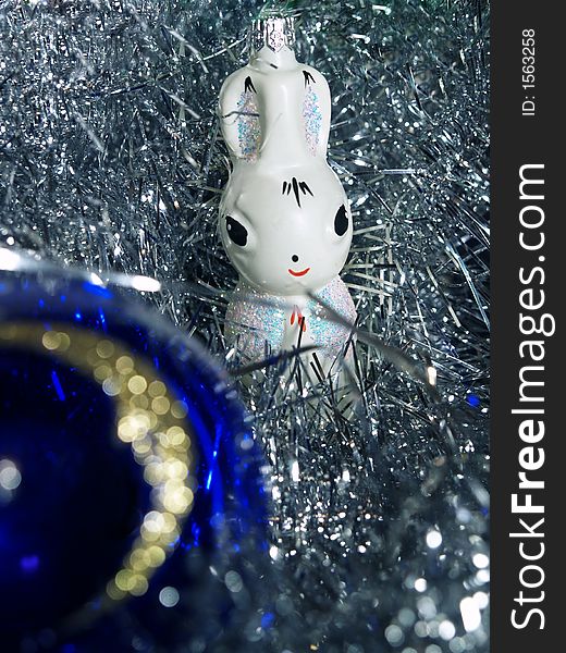 Christmas decoration white glass rabbit and blue closeup ball with golden moon. Christmas decoration white glass rabbit and blue closeup ball with golden moon