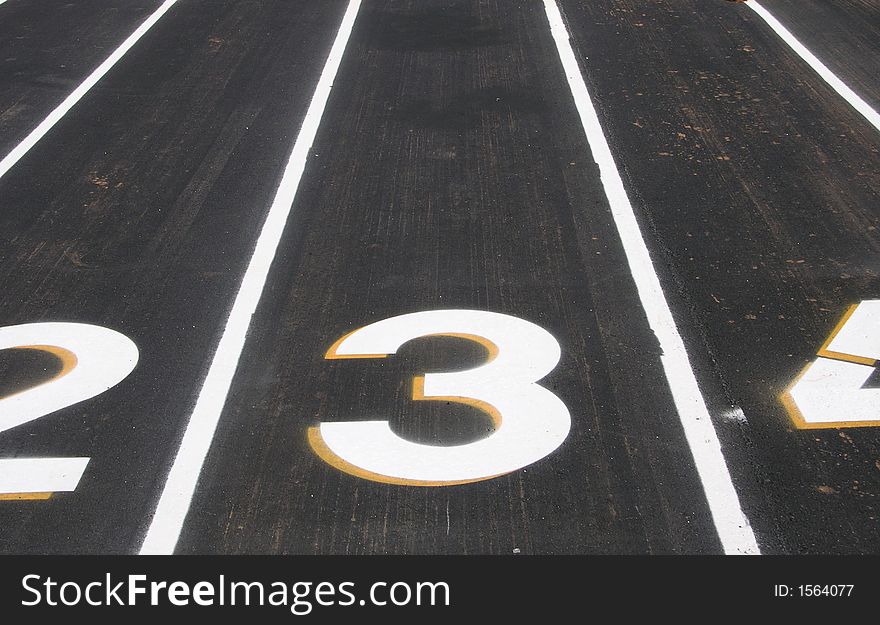 Closeup of a track an field stadium and the lane numbers. Closeup of a track an field stadium and the lane numbers