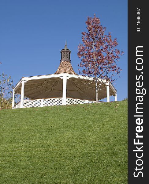 Replica of a Victorian bandstand surrounded by a grassy amphitheater.