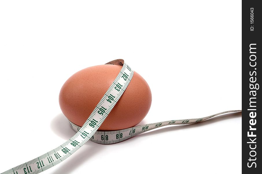 Measurement tape wrapped around the egg, nutrition concept