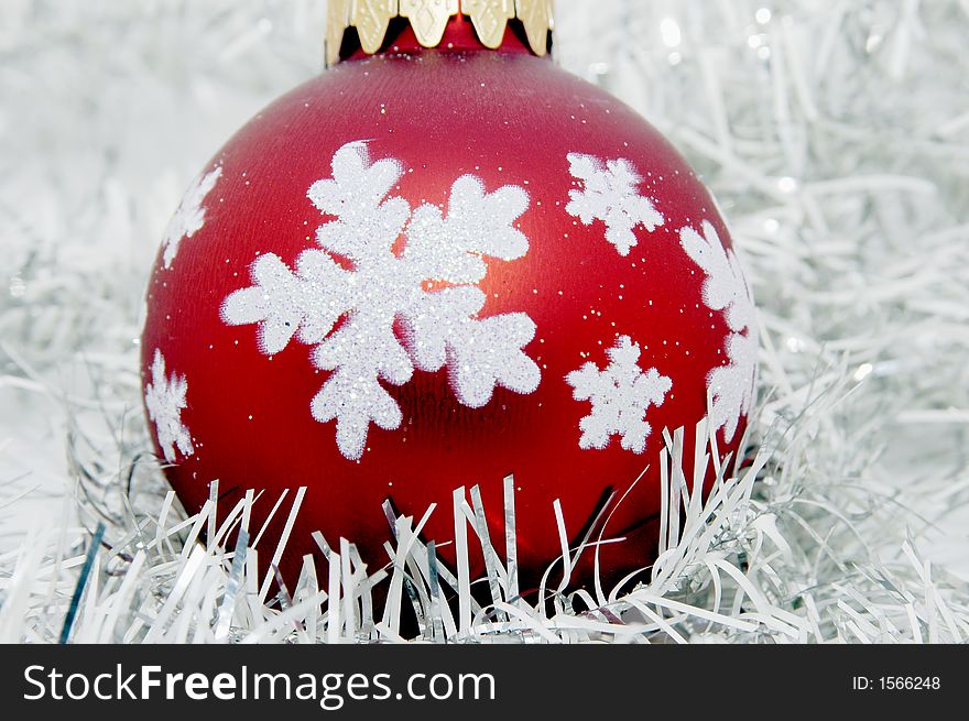 Red Christmas ball with white background and decoration. Red Christmas ball with white background and decoration