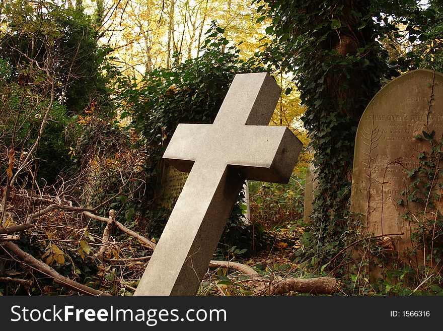 Striking religious cross in graveyard. Striking religious cross in graveyard