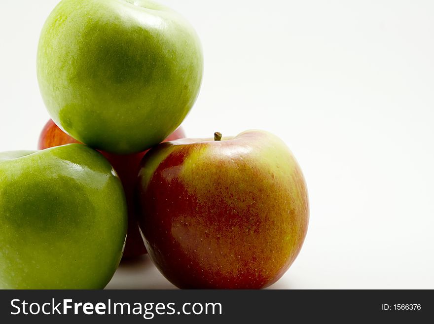 Red and Green Apples on a white background.