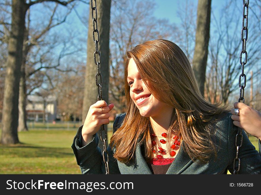 Young woman on the swings. Young woman on the swings