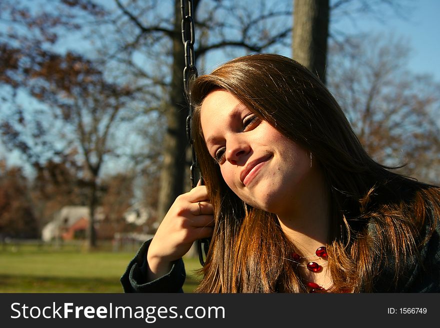 Young woman on the swings. Young woman on the swings