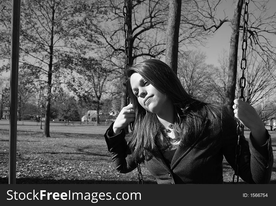 Young woman on the swings. Young woman on the swings