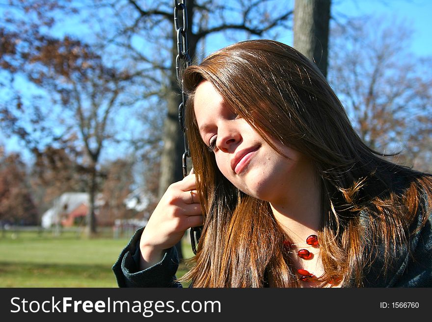 Young woman on the swings. Young woman on the swings