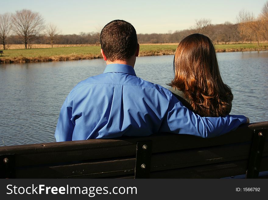 Young couple on park bench. Young couple on park bench