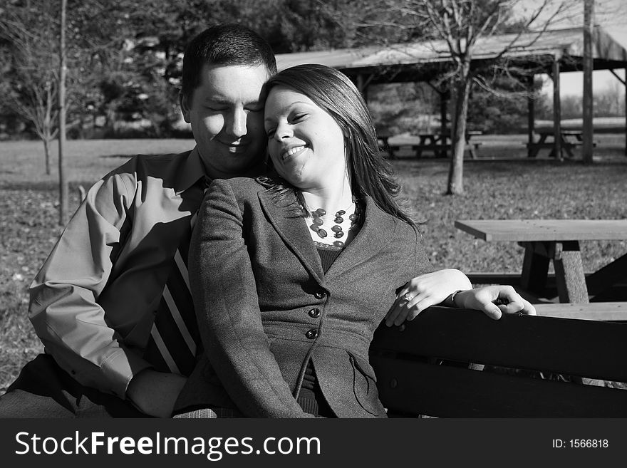 Young couple on park bench. Young couple on park bench