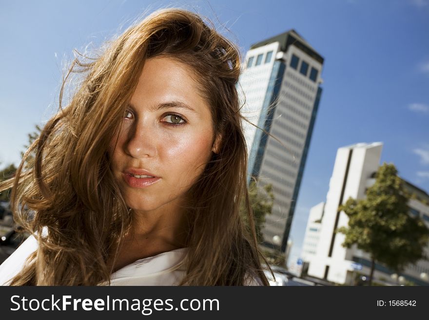 Young businesswoman in front of a building. Young businesswoman in front of a building