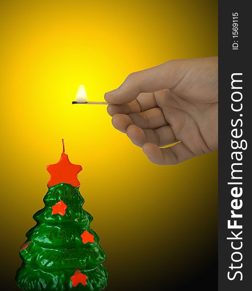 Candle (xmas tree) and hand with match